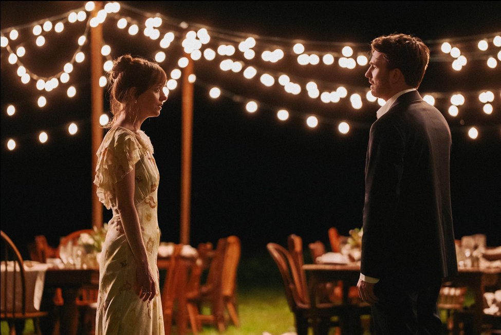 Dakota Johnson in Celine Song's "Materialists," looking indecisive in front of bright lights.